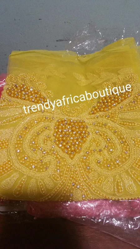 Assoted colors of heavily-beaded net for  making NIgerian women blouses. 1.8yds net and fully beaded for making blouse for party wrappers. 3 colors available in this design Delicate Pleat Blouse